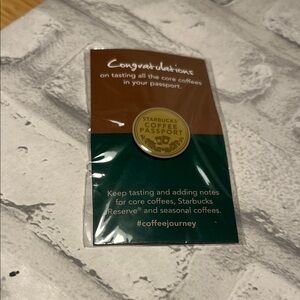 Starbucks Coffee gold tone is Passport Pin